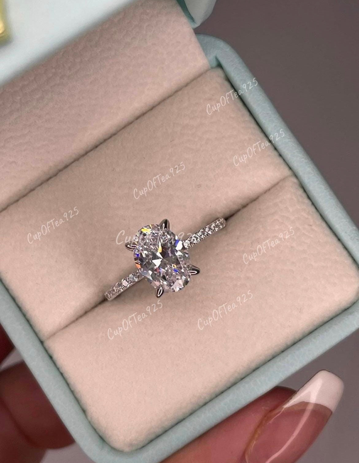 Hidden Halo. Sterling Silver 925 engagement ring with 2.2CT oval cut simulated diamond and hidden halo