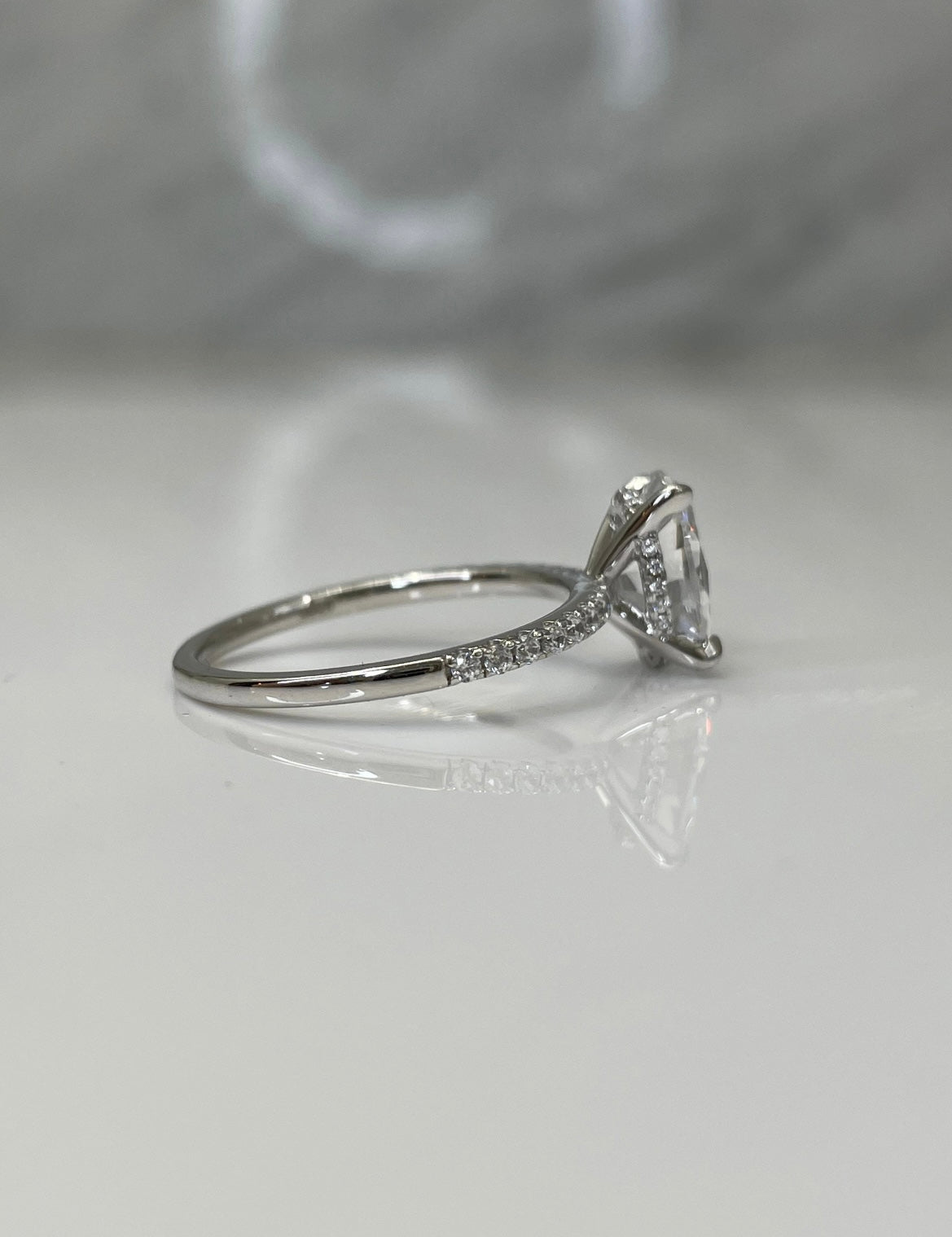 Hidden Halo. Sterling Silver 925 engagement ring with 2.2CT oval cut simulated diamond and hidden halo