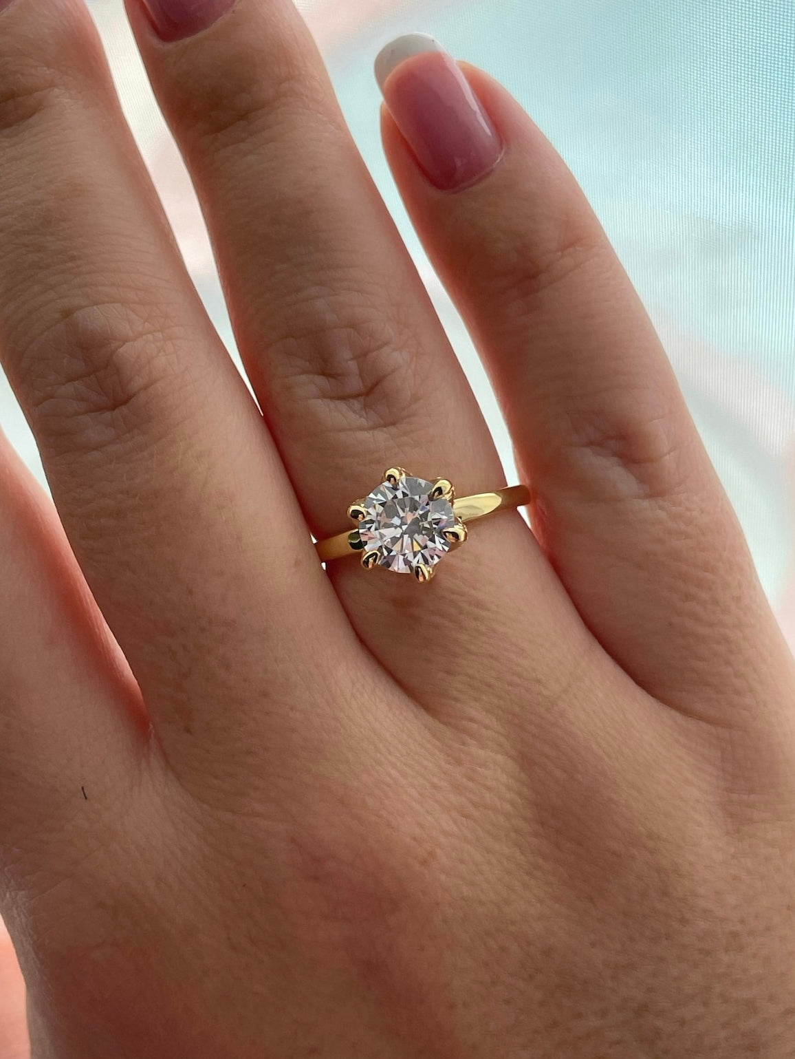 The Bella. Sterling Silver 925, yellow gold vermeil engagement ring with 2CT round brilliant cut simulated diamond.