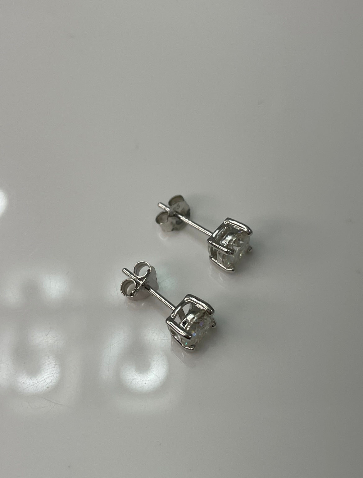 Moissanite stud earrings.