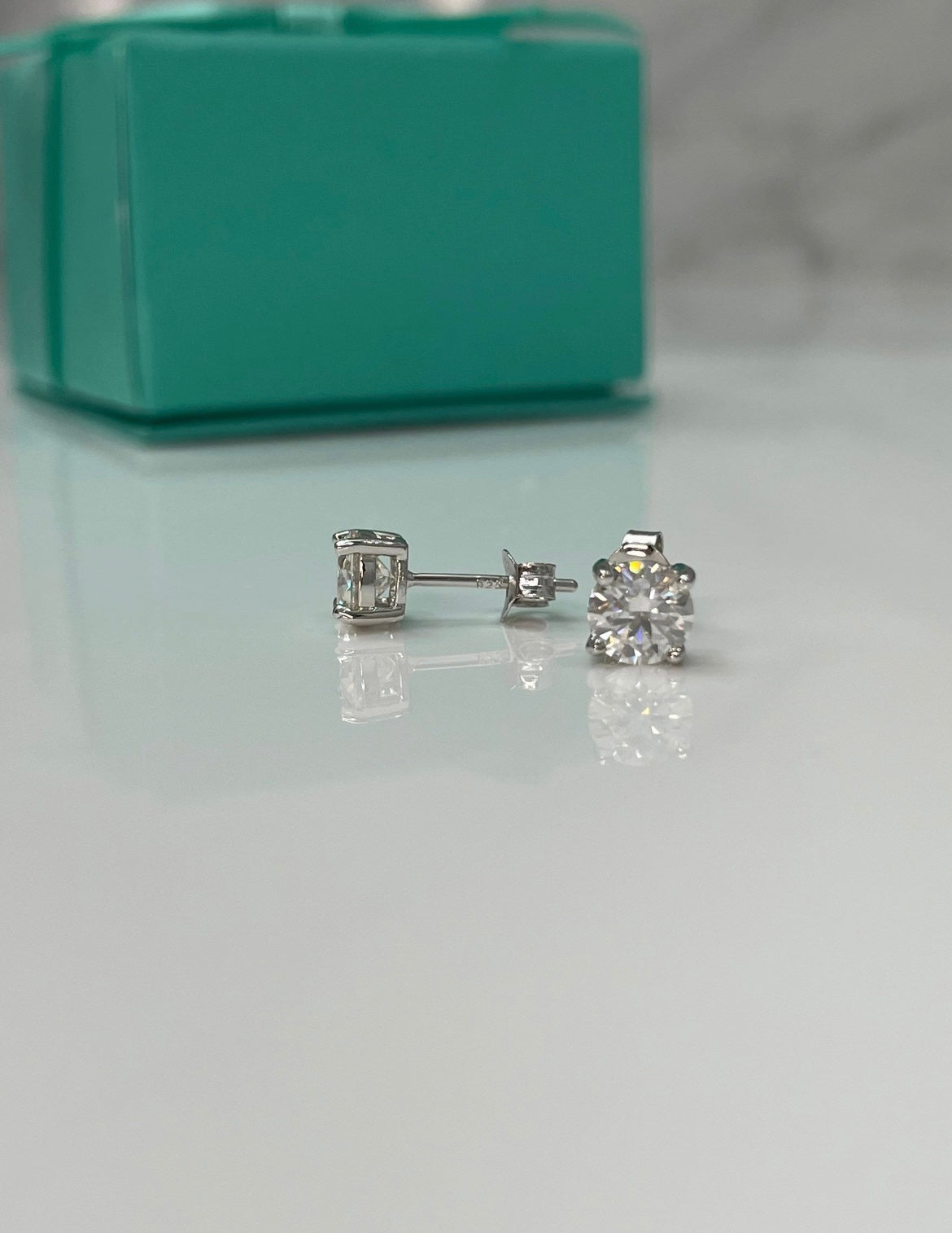 Moissanite stud earrings.