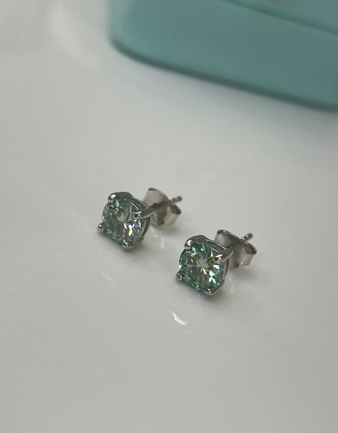 Certified aqua-blue-green moissanite stud earrings In Sterling Silver 925