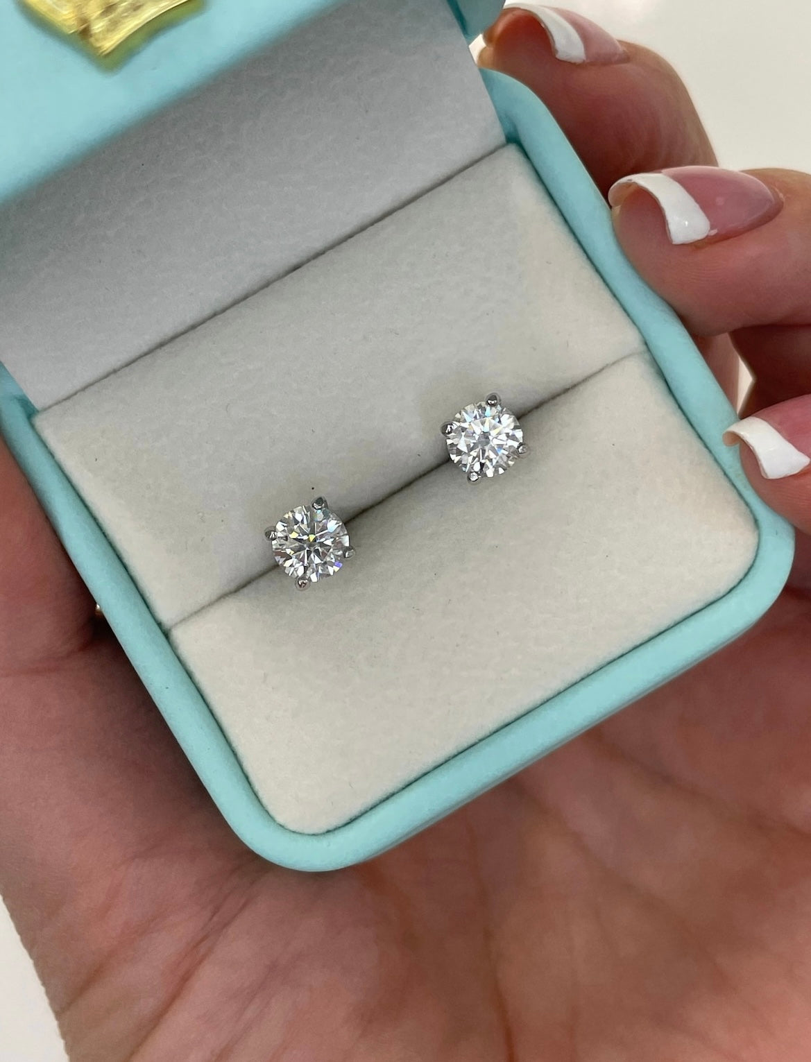 Moissanite stud earrings.