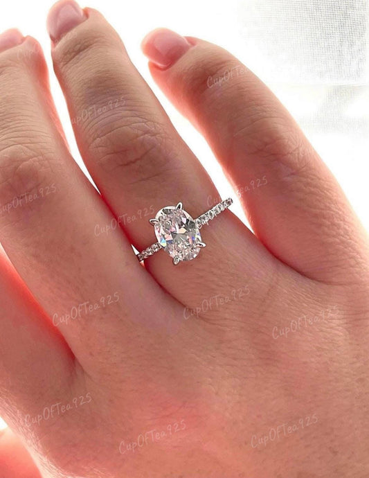 Hidden Halo. Sterling Silver 925 engagement ring with 2.2CT oval cut simulated diamond and hidden halo