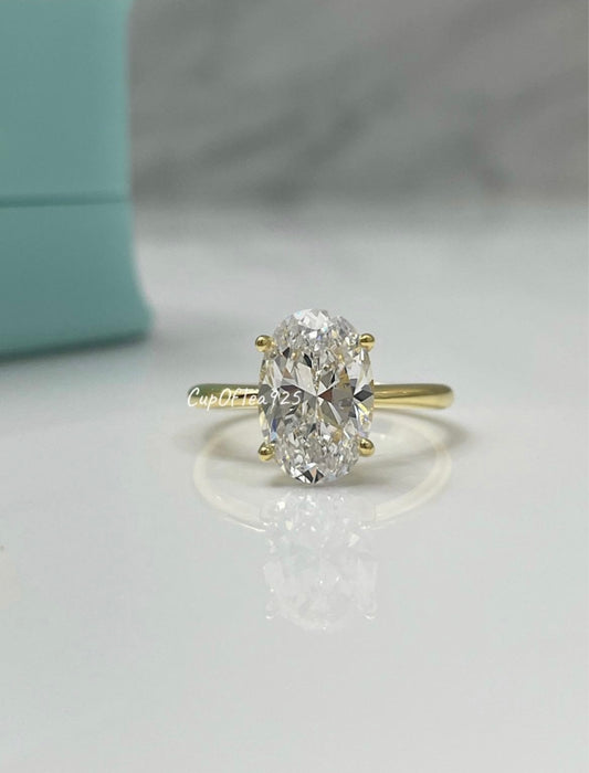 The Brooklyn. Yellow gold vermeil, white gold vermeil stunning solitaire with 3.5CT oval cut simulated diamond.