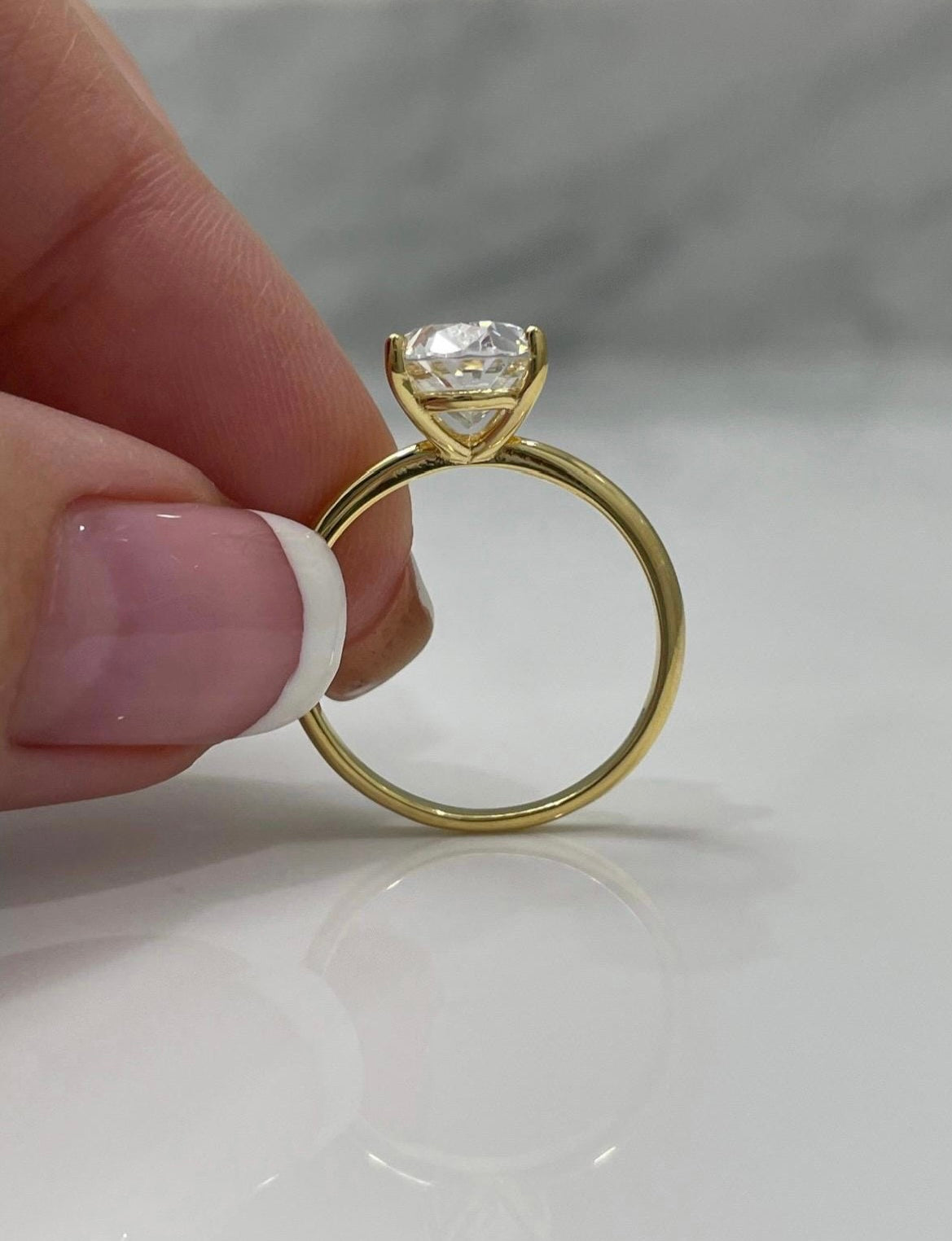 The Brooklyn. Yellow gold vermeil, white gold vermeil stunning solitaire with 3.5CT oval cut simulated diamond.