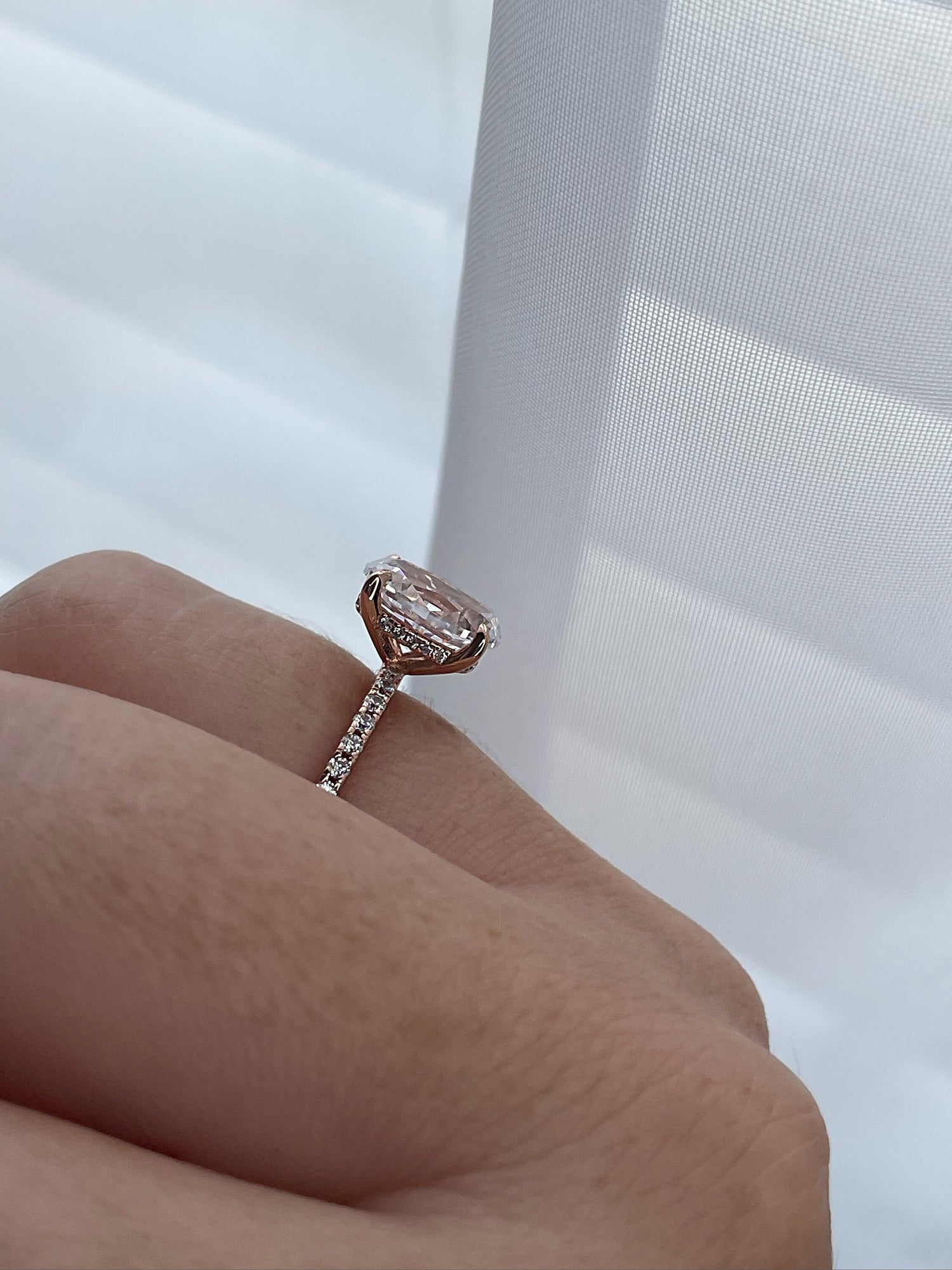 The Stella. Hidden Halo. Rose gold over Sterling Silver 925 engagement ring with 2.2CT oval cut the finest 6A CZ simulated diamonds