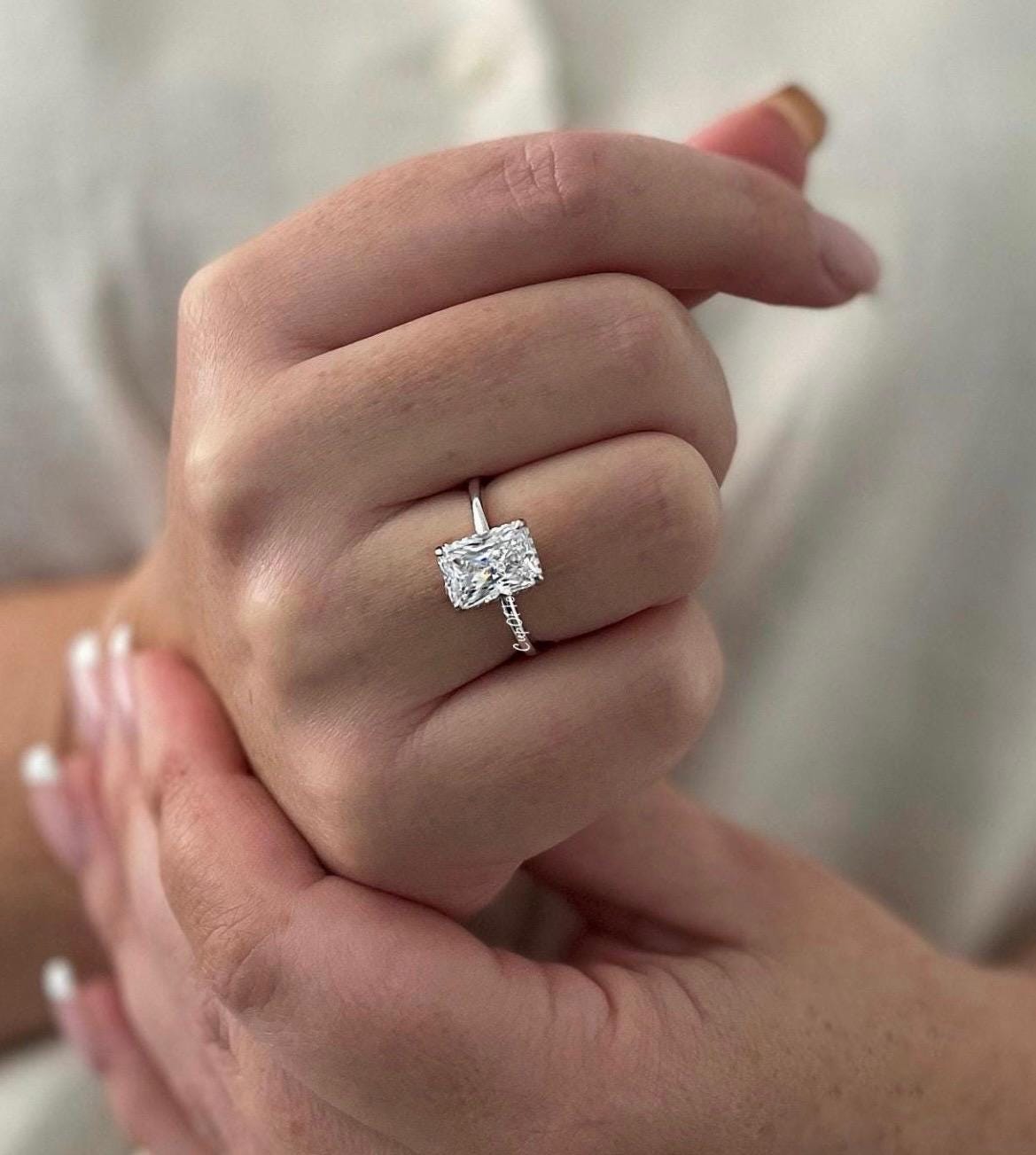 The Grace. Hidden halo. Sterling Silver 925 engagement ring with 2CT, 3CT radiant cut CZ simulated diamond and hidden halo.