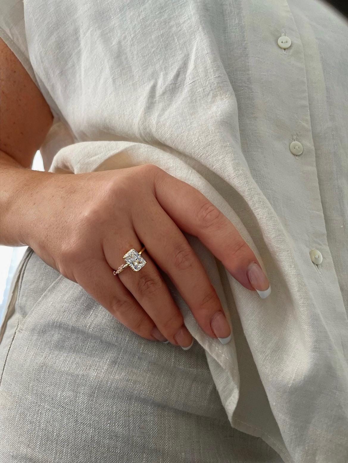 The Grace. Hidden halo. Sterling Silver 925 engagement ring with 2CT, 3CT radiant cut CZ simulated diamond and hidden halo.