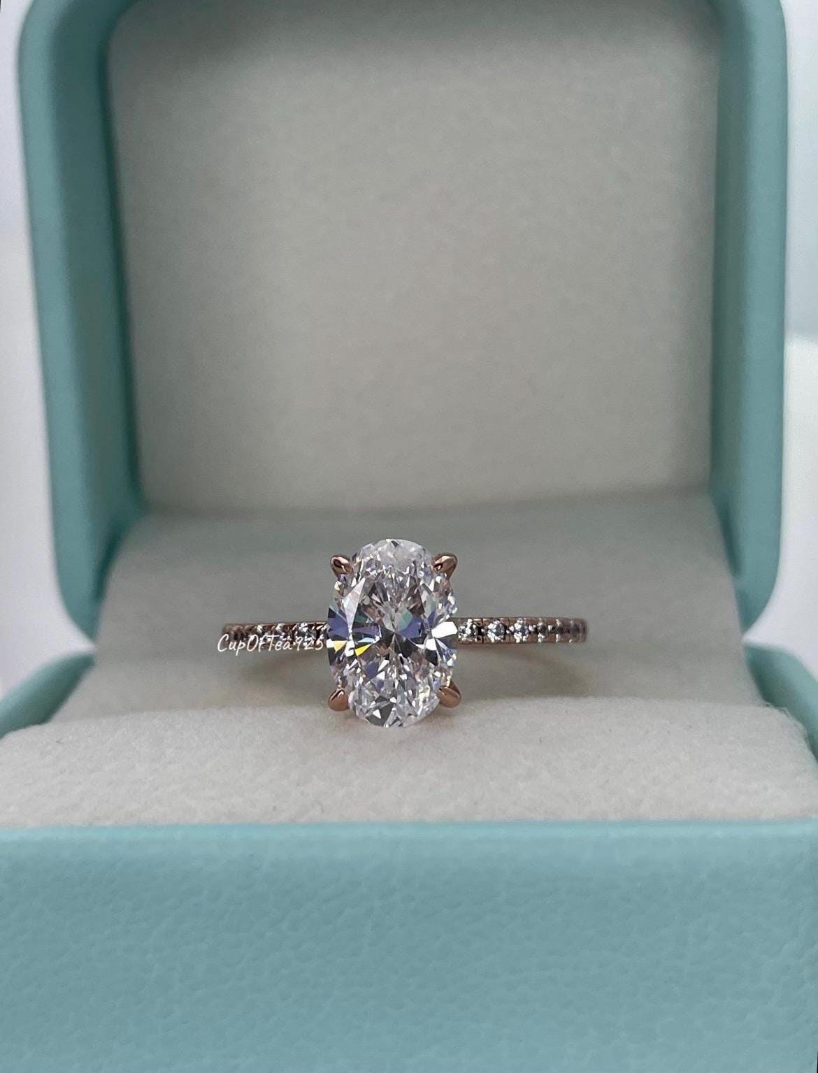 The Stella. Hidden Halo. Rose gold over Sterling Silver 925 engagement ring with 2.2CT oval cut the finest 6A CZ simulated diamonds