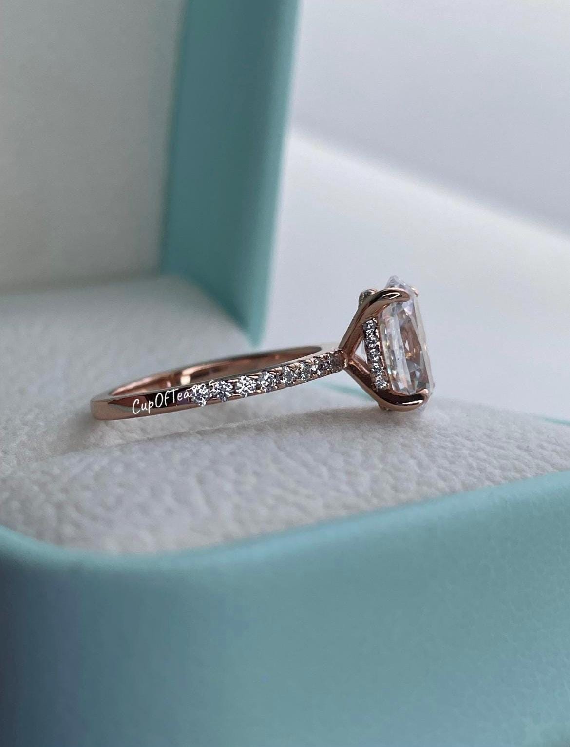The Stella. Hidden Halo. Rose gold over Sterling Silver 925 engagement ring with 2.2CT oval cut the finest 6A CZ simulated diamonds