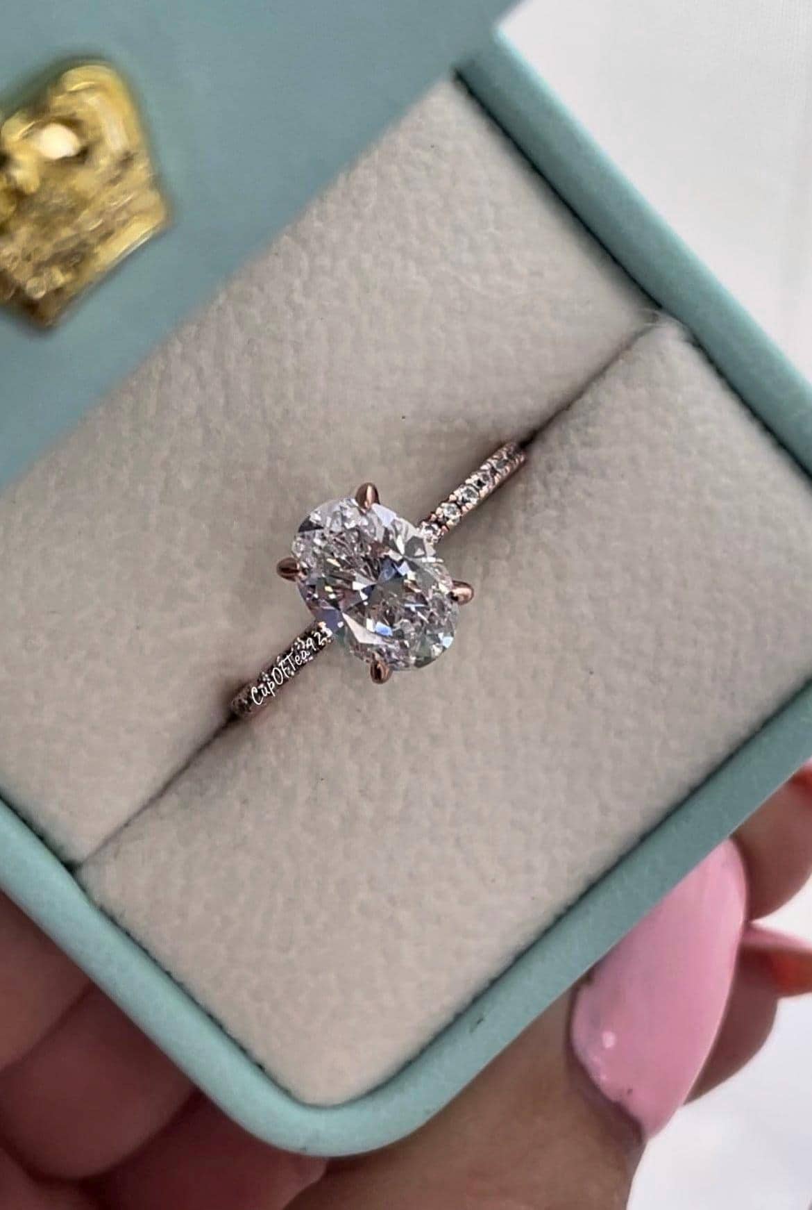 The Stella. Hidden Halo. Rose gold over Sterling Silver 925 engagement ring with 2.2CT oval cut the finest 6A CZ simulated diamonds
