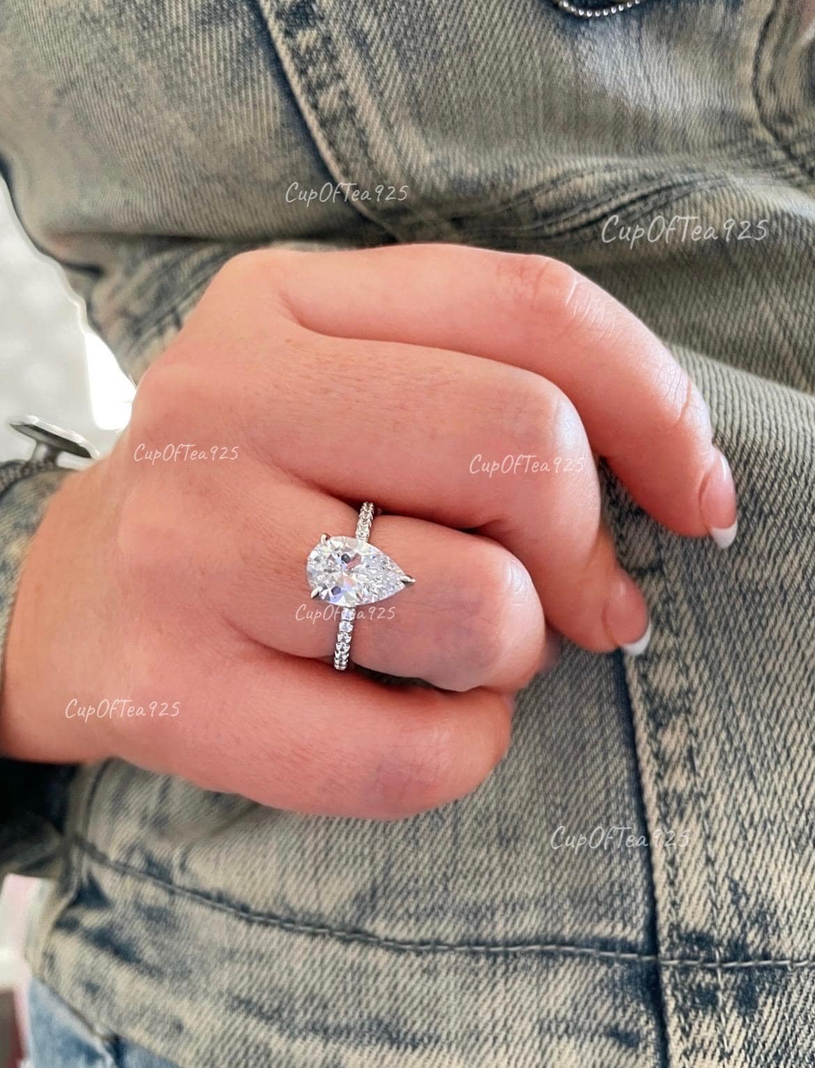 Pear cut ring with hidden halo. Sterling Silver 925 engagement ring with 3CT pear shaped simulated diamond and hidden halo.