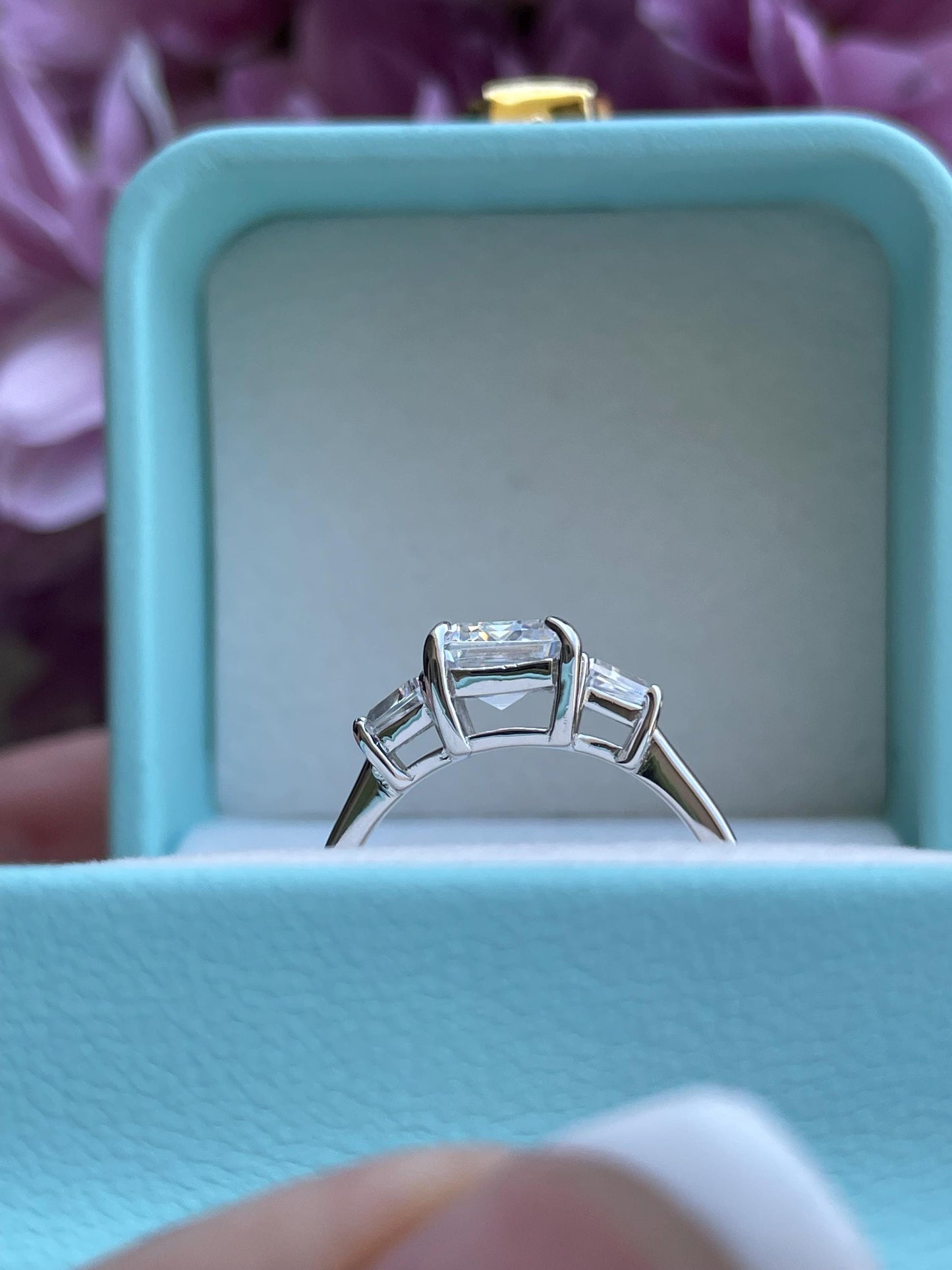 Three stone engagement ring with 3CT emerald cut CZ simulated diamond