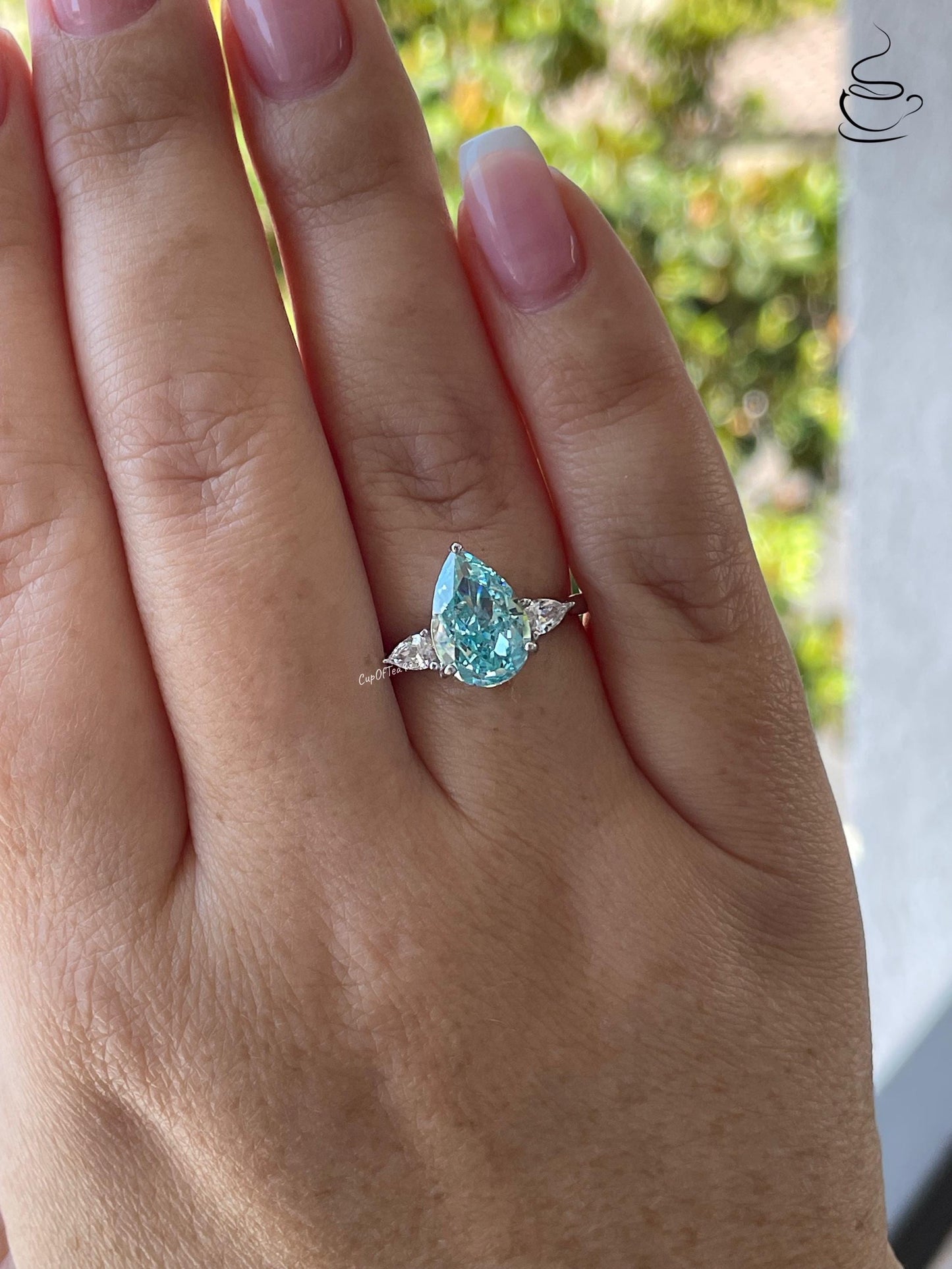 3 carat pear shaped engagement ring with blue crushed ice aquamarine simulated diamond in sterling silver or yellow gold vermeil