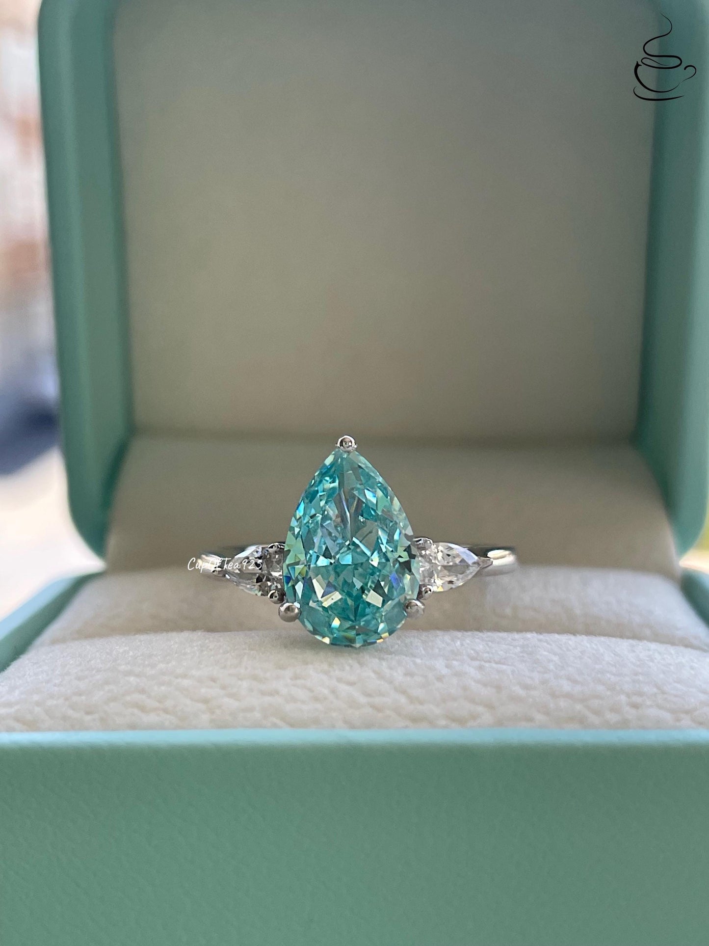 3 carat pear shaped engagement ring with blue crushed ice aquamarine simulated diamond in sterling silver or yellow gold vermeil