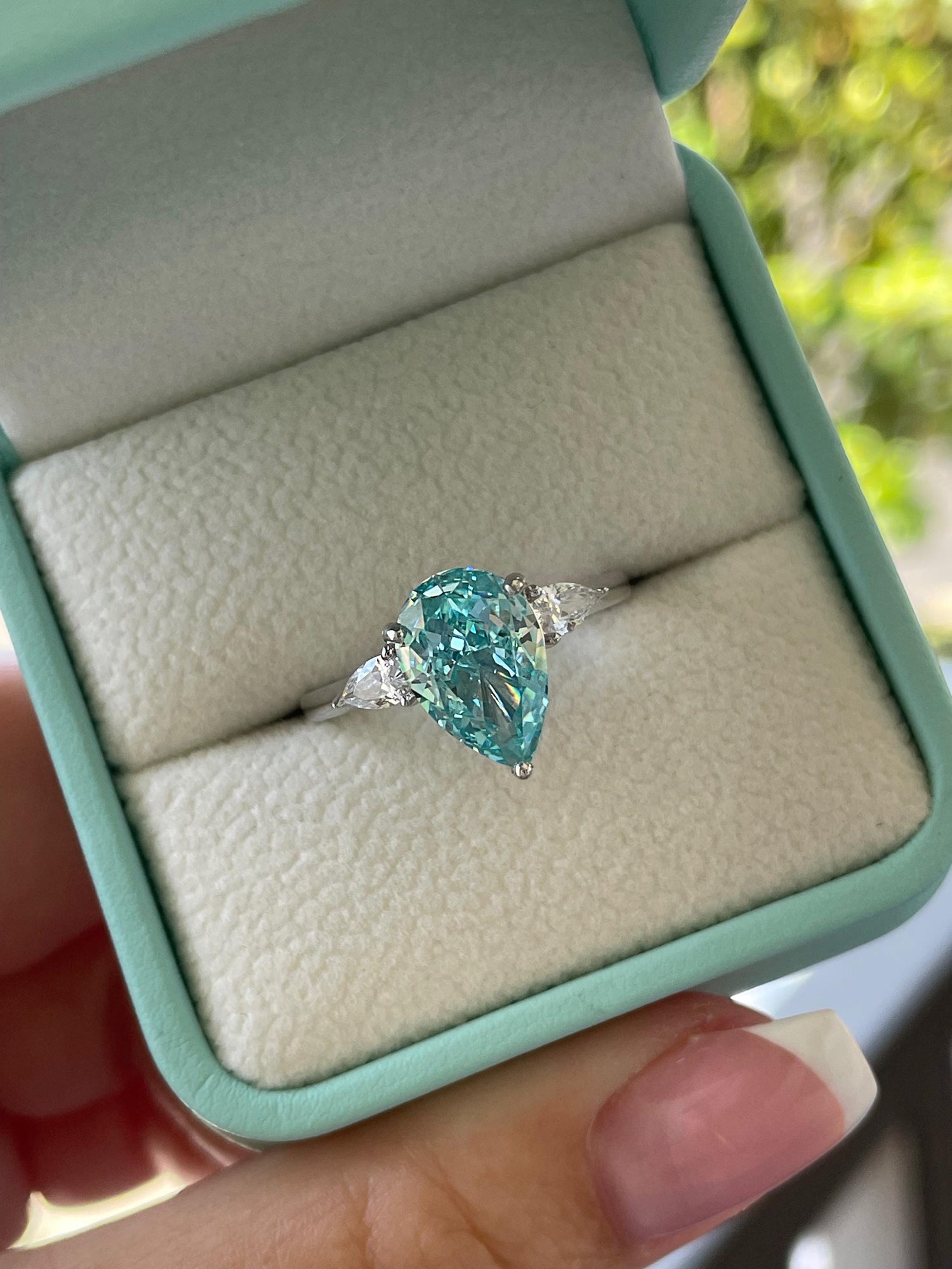 3 carat pear shaped engagement ring with blue crushed ice aquamarine simulated diamond in sterling silver or yellow gold vermeil