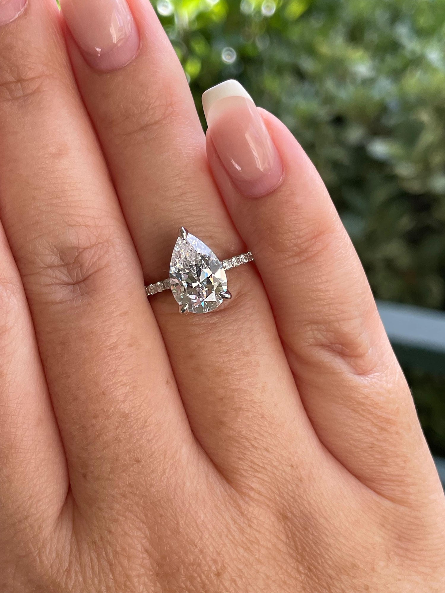 Pear cut ring with hidden halo. Sterling Silver 925 engagement ring with 3CT pear shaped simulated diamond and hidden halo.