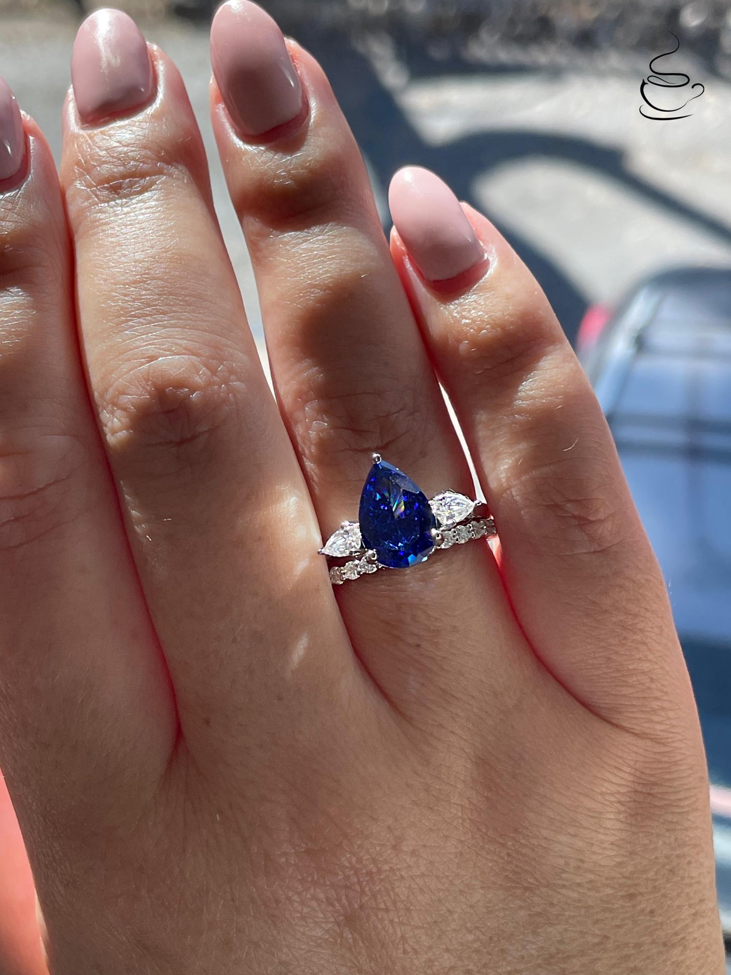There stone engagement ring with pear cut crushed ice blue sapphire and moissanite half eternity band, September birthstone ring