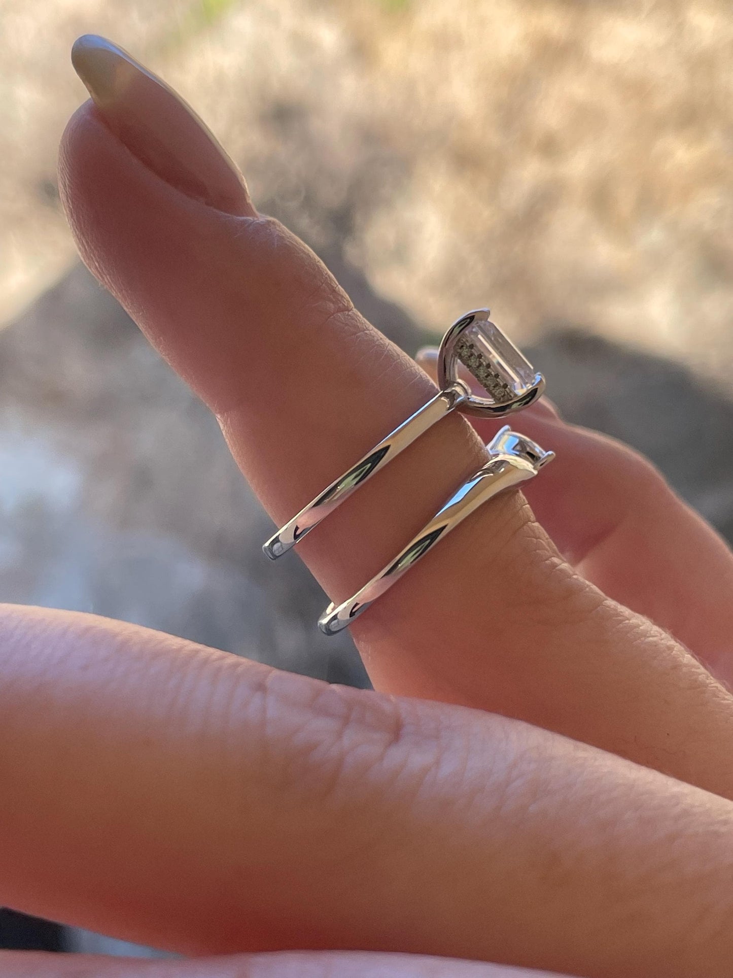 2 carat emerald cut moissanite engagement ring set. Sterling silver 925 bridal ring set with 2CT solitare with hidden halo and curved band.