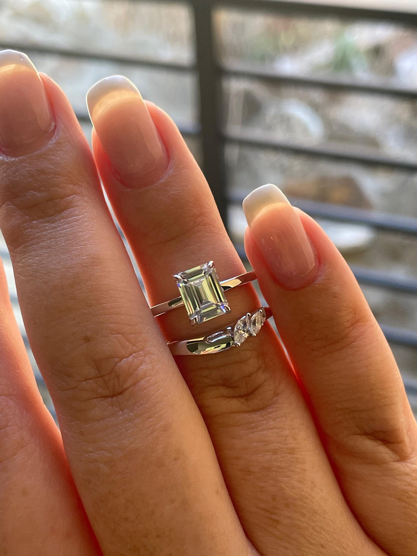 2 carat emerald cut moissanite engagement ring set. Sterling silver 925 bridal ring set with 2CT solitare with hidden halo and curved band.