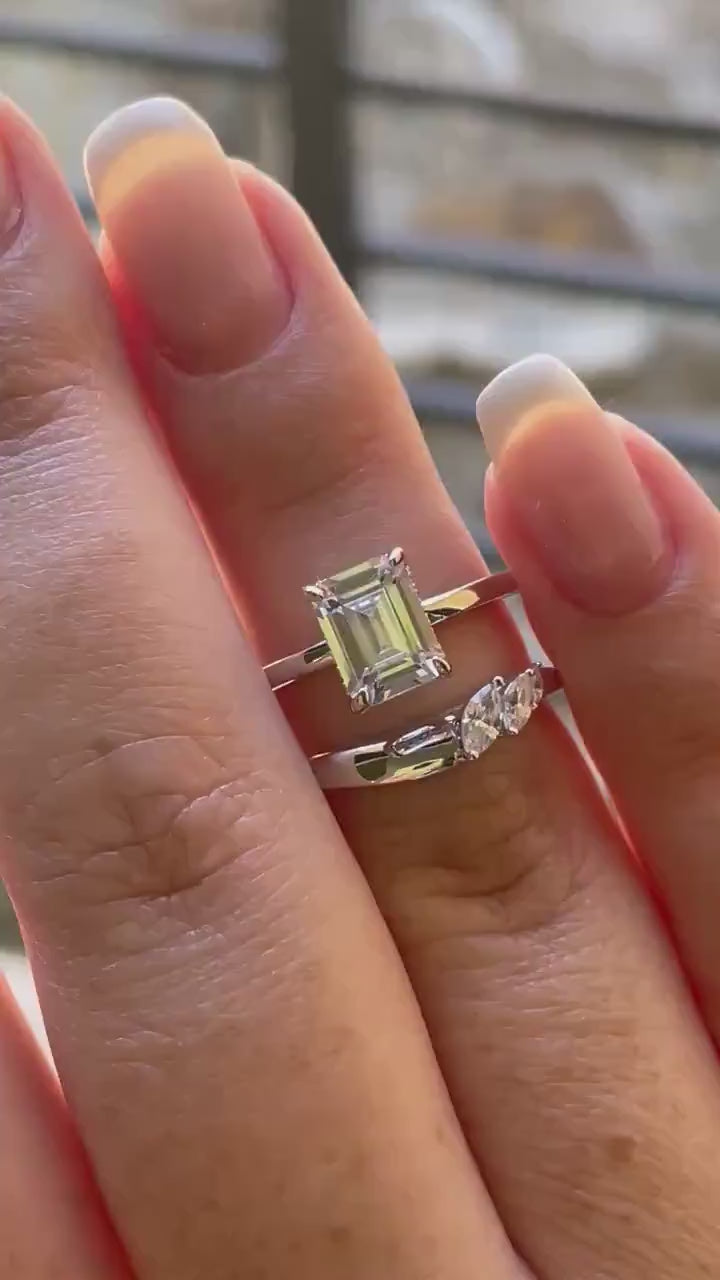 2 carat emerald cut moissanite engagement ring set. Sterling silver 925 bridal ring set with 2CT solitare with hidden halo and curved band.